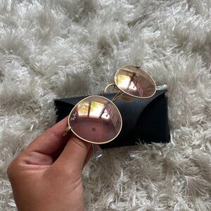 Ray-ban round flat lenses with polished gold frames and pink lenses
